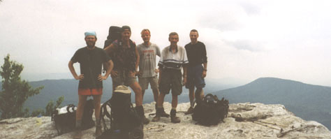 Five exhausted and happy men